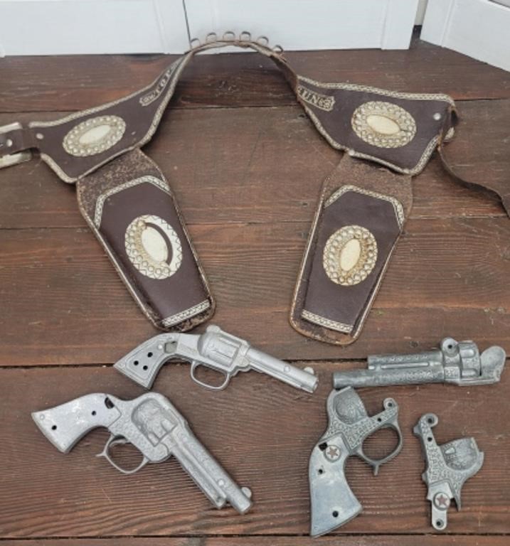 Toy holsters and cap guns - need work