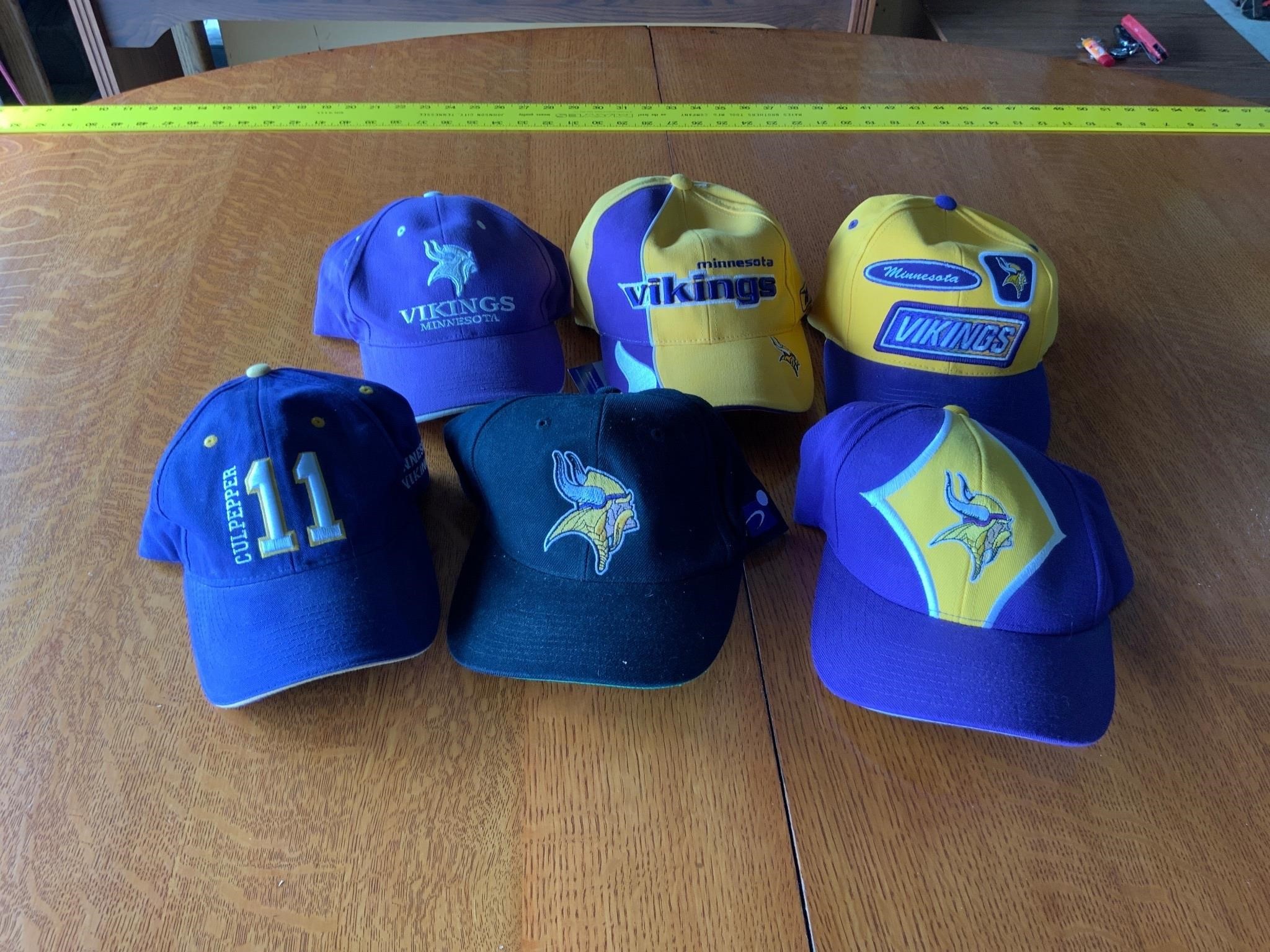 lot of Minnesota vikings hats - yellow and purple