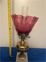 Antique lamp with cranberry shade