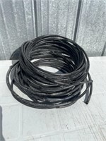 Black automatic waterer tubing.
