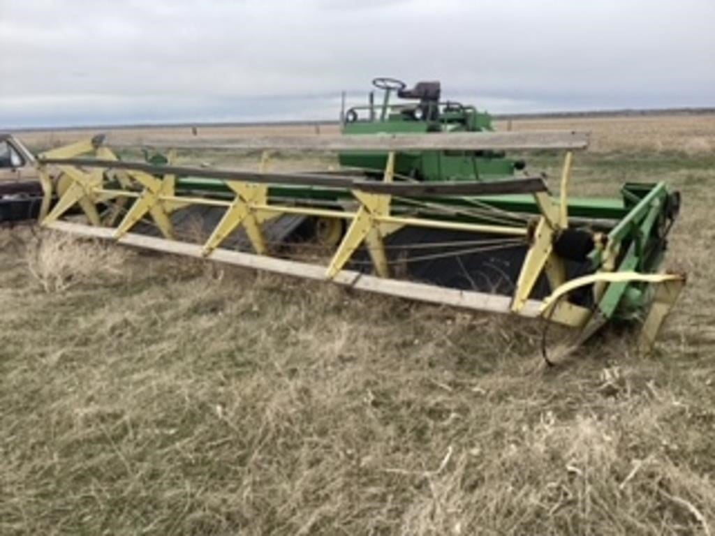 JD 800 SP swather 20 ft with Chrysler gas engine.