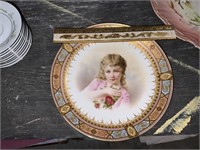large antique plate with girl's face