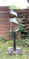 Brushed Swirl Steel Sculpture on Wood