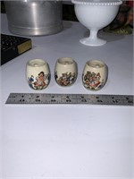 3 small vintage mugs with people
