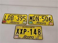 Three vintage alberta license plates
