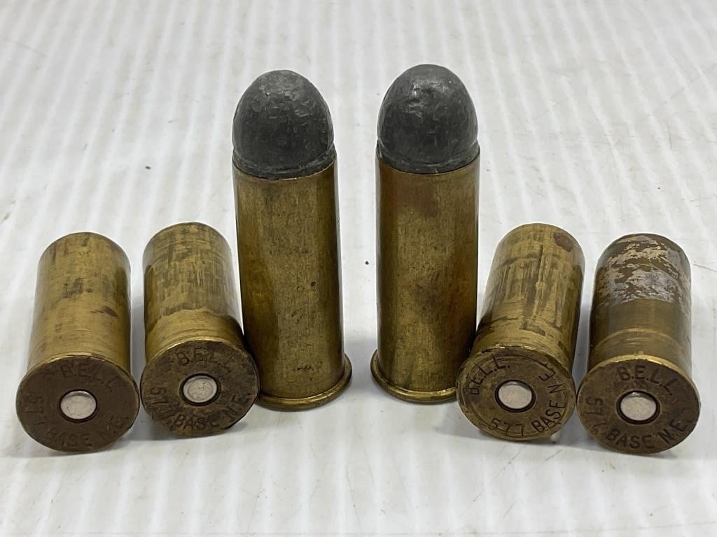 58 CAL. 4 PRIMED BRASS AND 2 LIVE ROUNDS