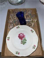 lot of rose plates and shot glasses