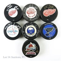 Autographed Hockey Pucks (8)