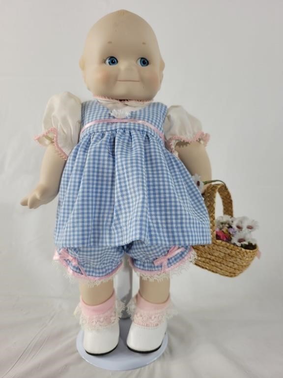 Kewpie doll with basket and stand