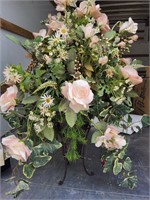 Large floral arrangement in metal vase
