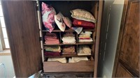 CONENTS OF ARMOIRE - PILLOWS, TABLE LINENS