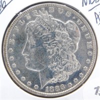 1886 Nice/AU Morgan Silver Dollar.