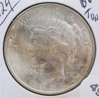1924 BU and Toning Peace Silver Dollar.
