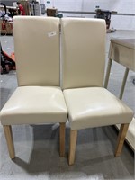 set of two white leather chairs