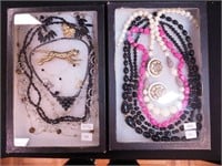 Two containers of costume jewelry: hematite and