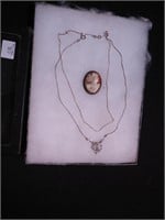Sterling pin with carved shell cameo, 18" chain