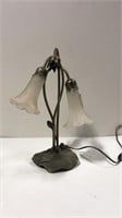 Antique lamp with iron lily pad base, missing one