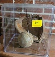 ANTIQUE BASBALL GLOVE AND SOFTBALL IN DISPLAY
