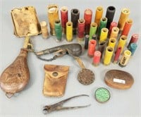 Collection of antique shotgun shells, shot flask,