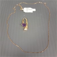 14K gold pendant set with trillion amethyst with