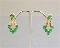 Pair of 14K gold earrings set with emeralds &