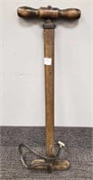 Antique embossed Ford brass tire pump - 22" tall