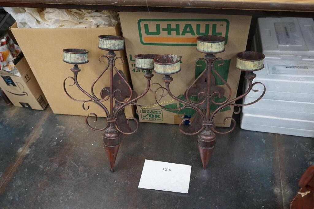 pair of metal wall sconces for candles