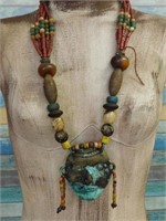 AFRICAN TRADE BEADS WITH METAL MASK ACCENT