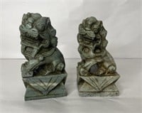 Pair of carved marble foo dogs