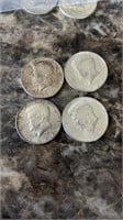 4 1964 Kennedy half dollars