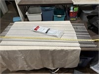 Two Rubbermaid 58 inch shelves and brackets
