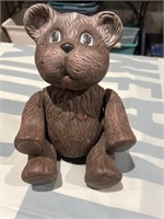 Ceramic teddy bear, head, arms, and legs do move.