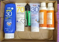 Lot of sunscreen and hand sanitizer