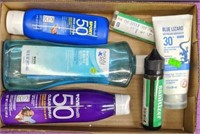Lot of sunscreen, hand sanitizer, and body oil