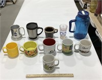 Lot of mugs w/ plastic cup & bottle