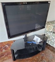 PANASONIC TV WITH REMOTE AND ON STAND