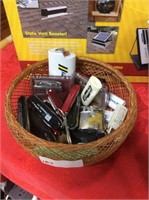 Basket of assorted lighters and pocket knives