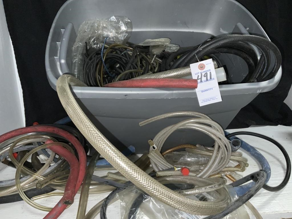 TOTE FULL OF HOSES AND TUBE CUT