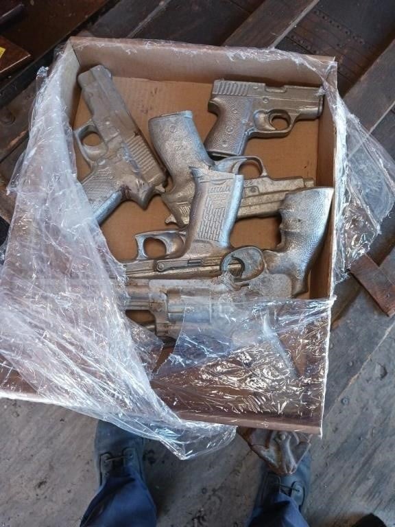 BOX OF CAST IRON TOY GUNS