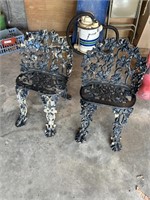 2 cast iron antique chairs