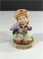 Vintage September Girl Holding Flower Porcelain