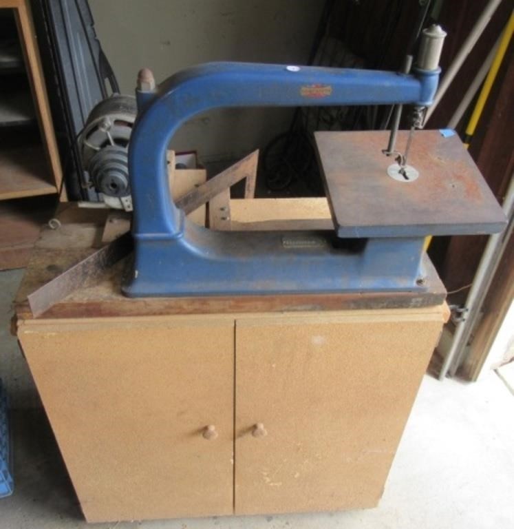 Sears band saw on stand.