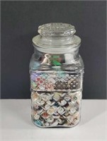 Buttons in large sealing glass canister