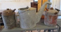 Galvanized watering can and (2) fuel cans.