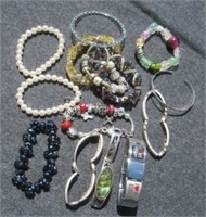 Bag of various fashion jewelry bracelets.
