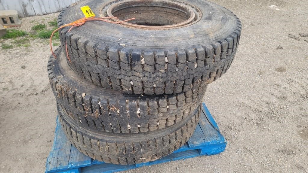 Three 11R22.5 tires on open center rims
