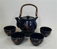 Vintage porcelain Teavana teapot with wicker