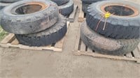 Four 11.00-20 tires on open center rims
