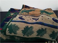 Two fuzzy western themed blankets