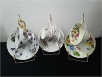 3 collectible teacups and saucers with displays